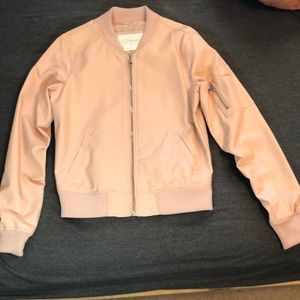 Faux pink leather jacket.